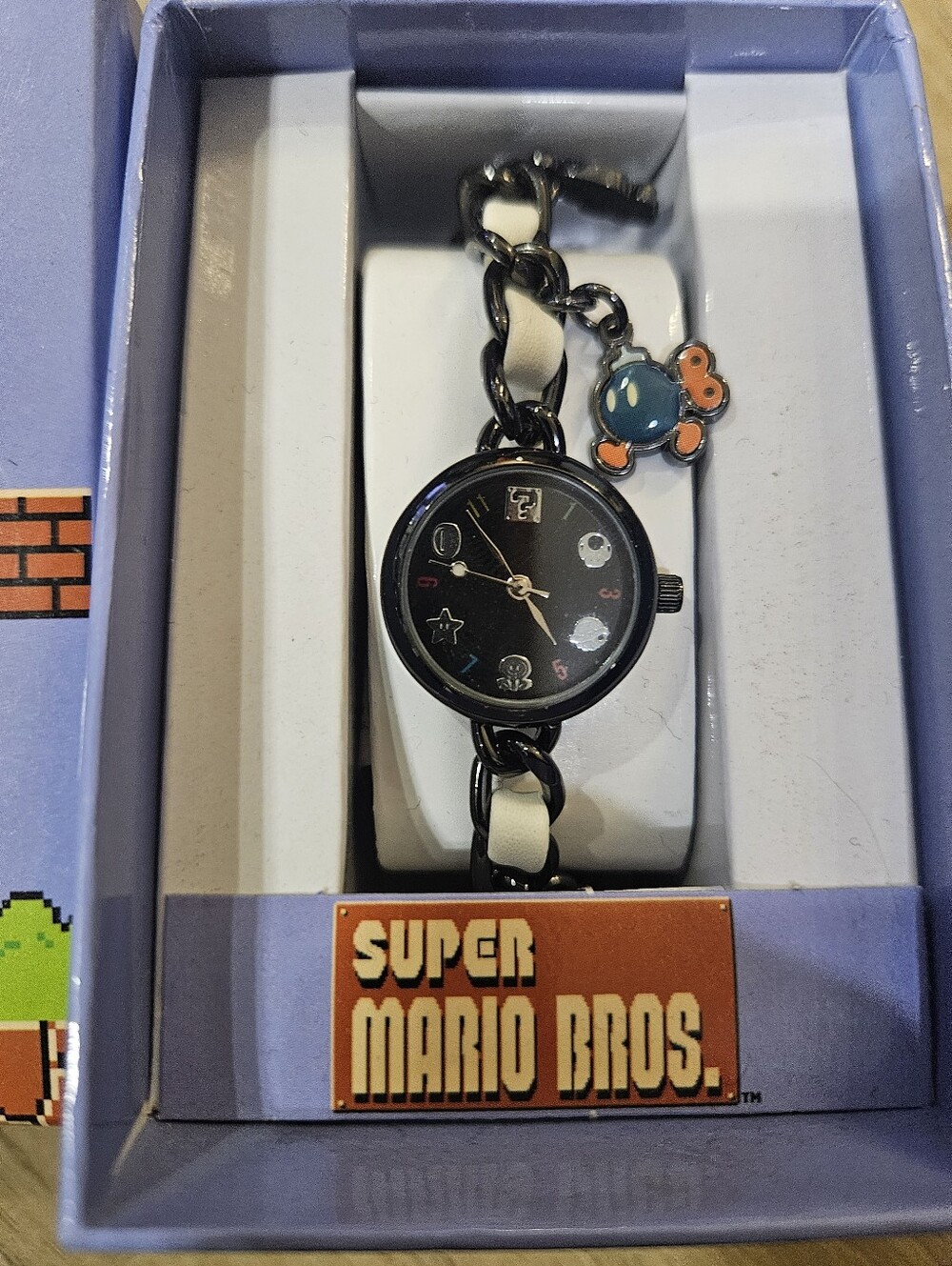 Nintendo Mario Black Watch with Cream Chain Links and Charms.